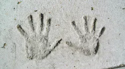 Handprints in Cement. A child s handprints in the cement of a sidewalk along Beacon Street in Boston