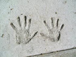 Handprints in Cement. A child s handprints in the cement of a sidewalk along Beacon Street in Boston Handprints in Cement. A child s handprints in the cement of a sidewalk along Beacon Street in Boston