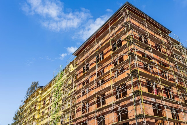 Multifamily residential building under construction in Santa Clara; the entire Silicon Valley and San Francisco Bay Area is facing a housing crisis, with increased housing costs
