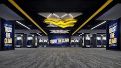 West Virginia University’s football locker room highlights integrated audio and lights within the space West Virginia University’s football locker room highlights integrated audio and lights within the space