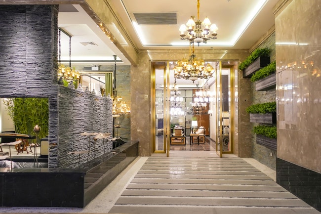 Luxury hotel lobby corridor hotel passageway. Luxury hotel lobby lit by pendant lighting