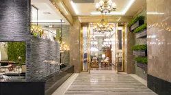 Luxury hotel lobby corridor hotel passageway. Luxury hotel lobby lit by pendant lighting
