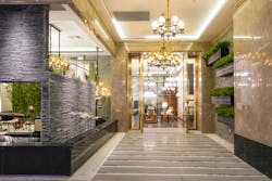 Luxury hotel lobby corridor hotel passageway. Luxury hotel lobby lit by pendant lighting Luxury hotel lobby corridor hotel passageway. Luxury hotel lobby lit by pendant lighting