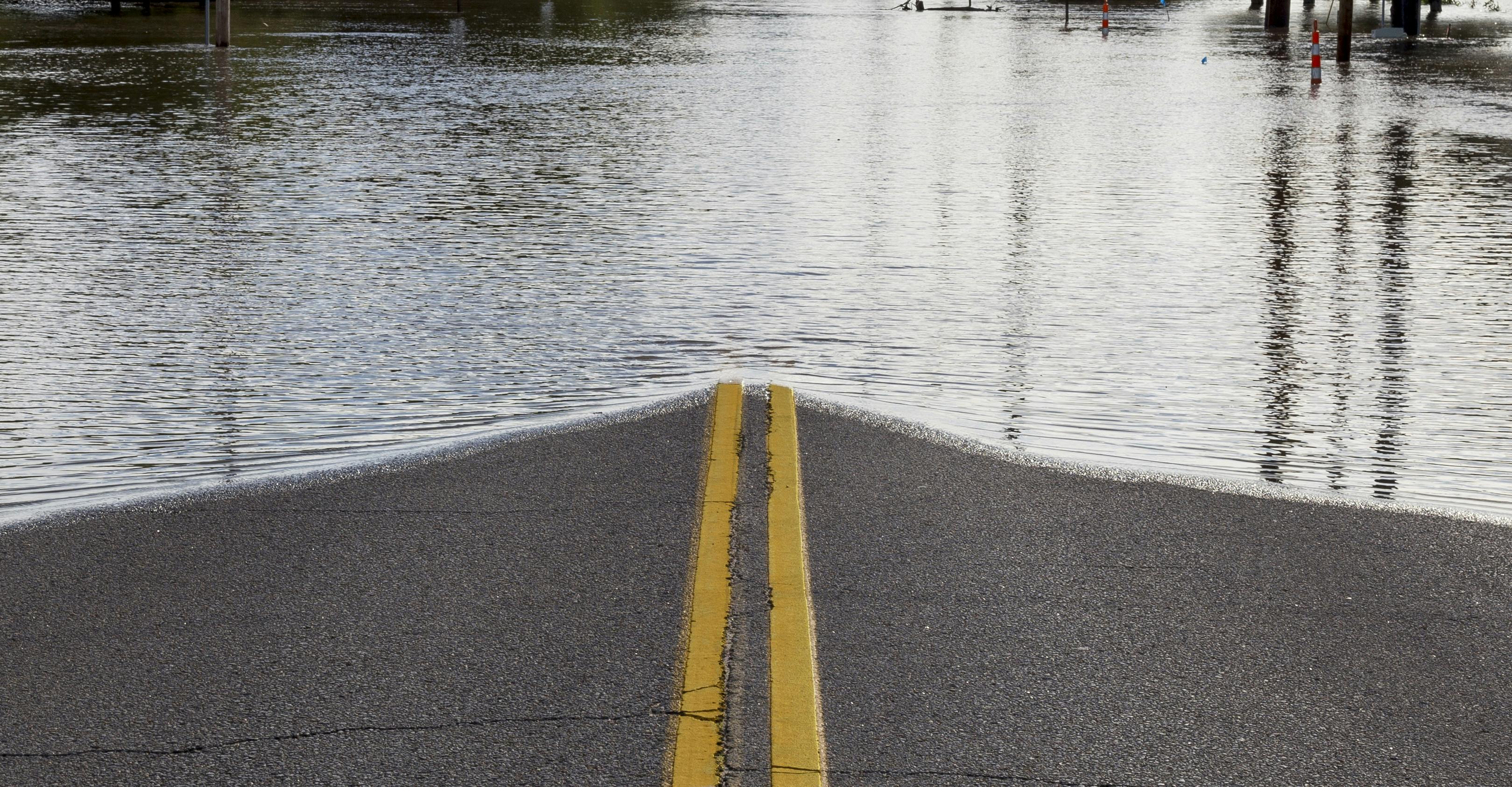 Road Closure From Flooding. Road closed due to river flooding in neighborhood.