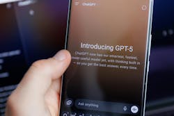 Smartphone screen showing Introducing GPT-5 announcement for ChatGPT, with a hand holding the device Smartphone screen showing Introducing GPT-5 announcement for ChatGPT, with a hand holding the device