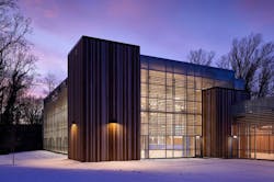 The deciduous trees surrounding the Cahill Recreation Center filter sunlight through the wintry landscape The deciduous trees surrounding the Cahill Recreation Center filter sunlight through the wintry landscape