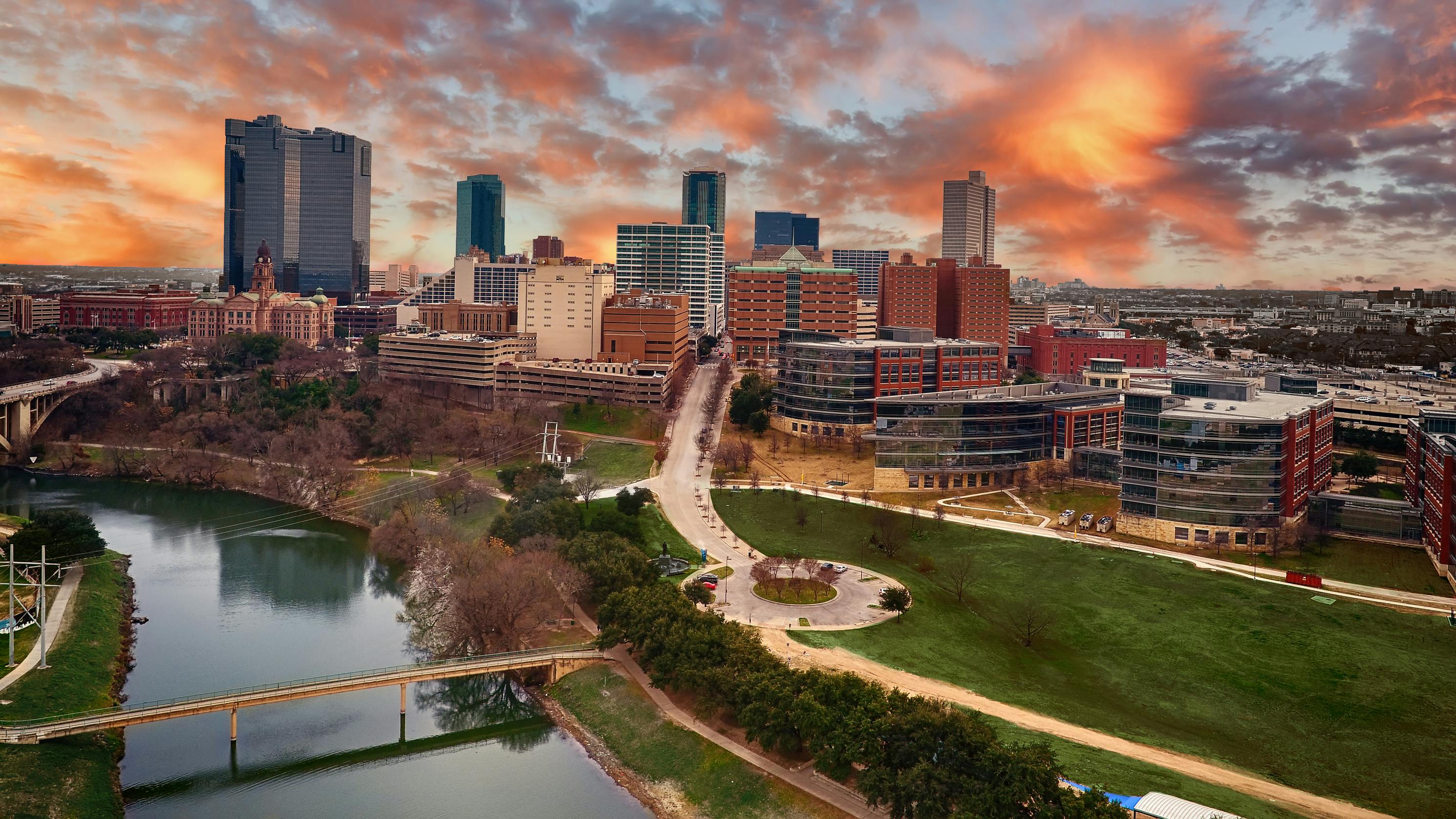 Ariel view of downtown Fort Worth, Texas taken at sunset with Trinity River in the foreground