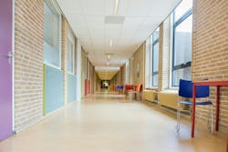 Long corridor with furniture in school building. Long corridor with furniture in school building.