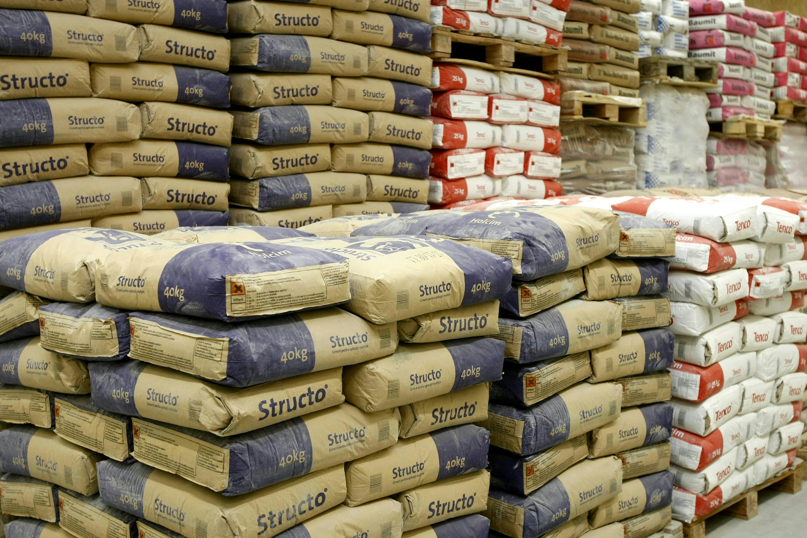 Cement department in construction materials store. Stacks of cement bags and construction materials are displayed in an Do-it-yourself (DOY) hardware store