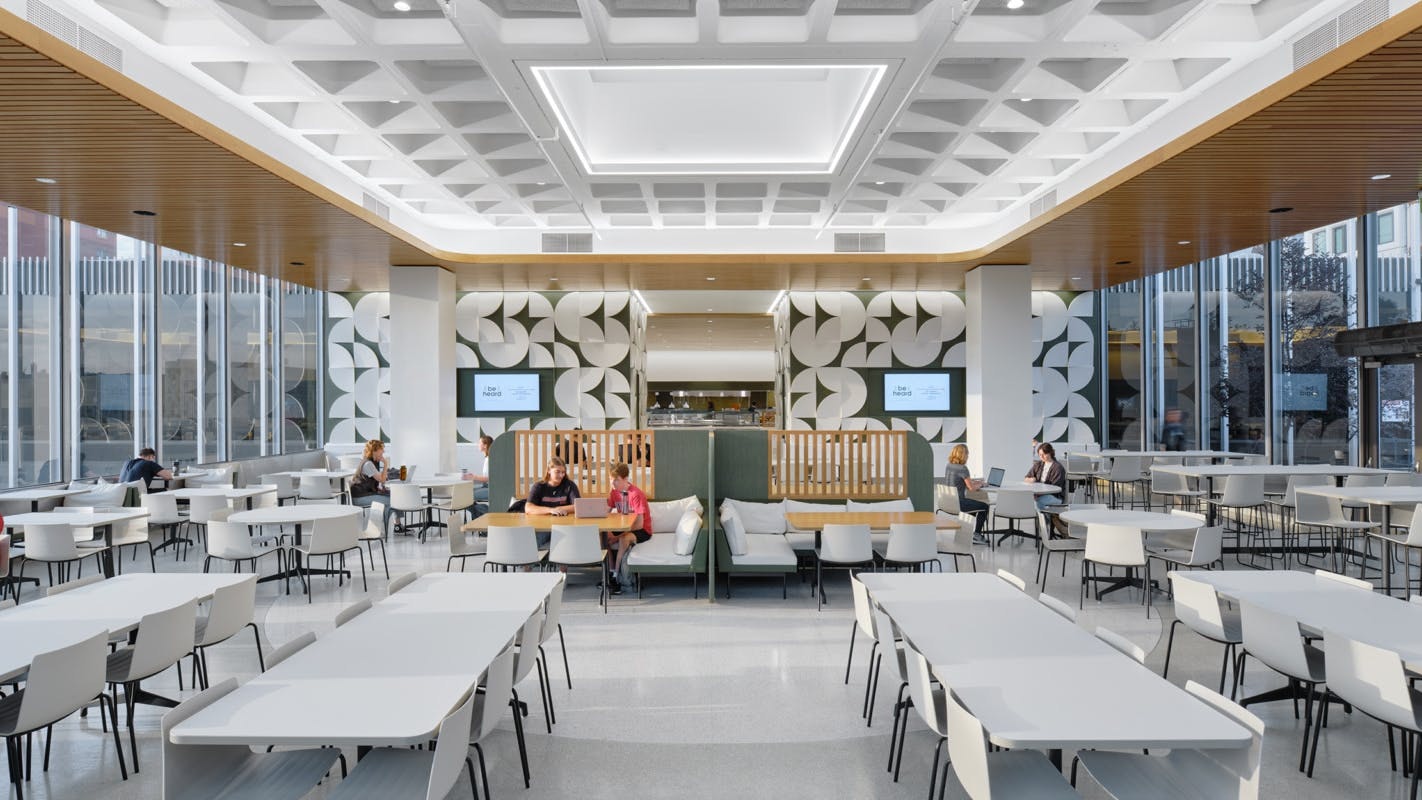 UC&rsquo;s MarketPointe dining hall offers a quieter experience through enhanced acoustics and softer seating and seating with views overlooking campus. Photo courtesy GBBN