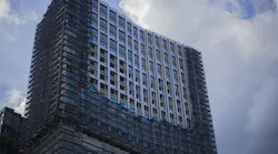 The construction of a high-rise building. Business center in the city. Urban planning for the construction of new buildings. Architecture in modern times. Office house