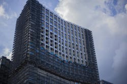 The construction of a high-rise building. Business center in the city. Urban planning for the construction of new buildings. Architecture in modern times. Office house The construction of a high-rise building. Business center in the city. Urban planning for the construction of new buildings. Architecture in modern times. Office house