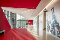 At the University of Southern Indiana, bold red paths guide visitors through the Physical Activities Center, creating an intuitive sense of movement and direction. Photo courtesy CannonDesign At the University of Southern Indiana, bold red paths guide visitors through the Physical Activities Center, creating an intuitive sense of movement and direction. Photo courtesy CannonDesign
