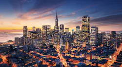 San Francisco aerial view from sea side. Port of San Francisco in the front. City downtown and skyscrapers at sunrise.