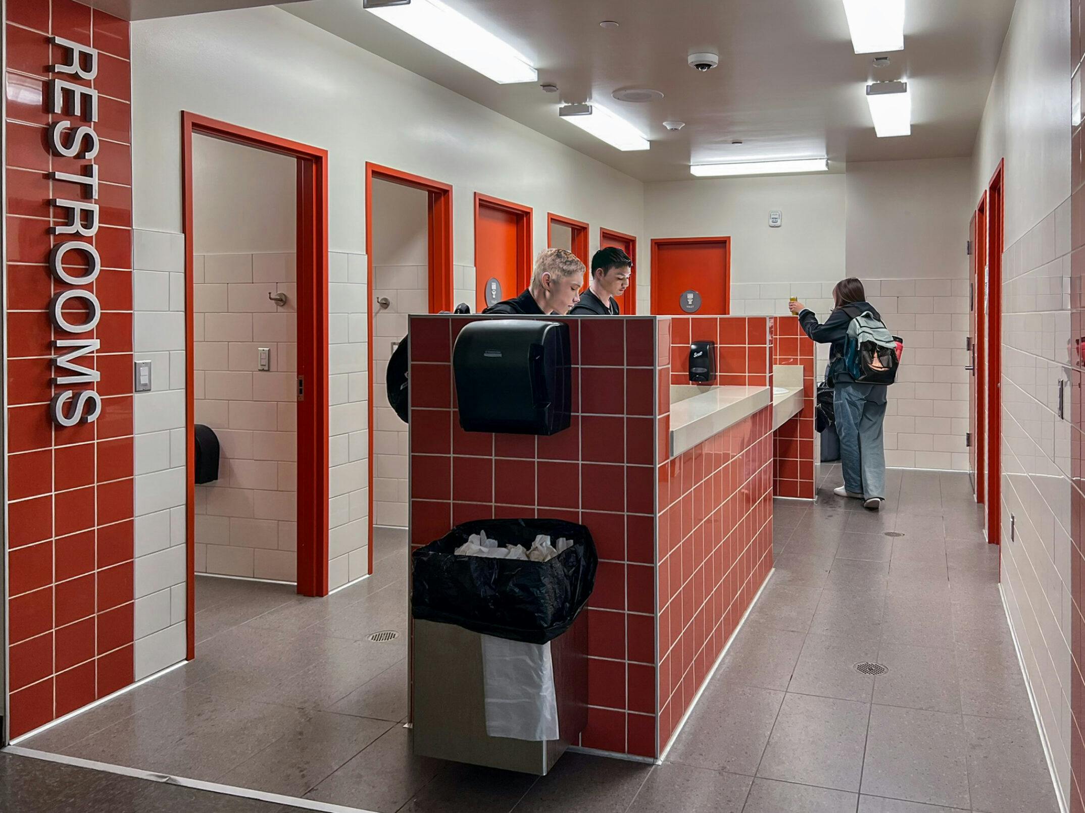 Single‑user restrooms at Graham‑Kapowsin High School are located off a main hallway in one wing, integrating universal access into daily student movement. Photo &copy; NAC Architecture