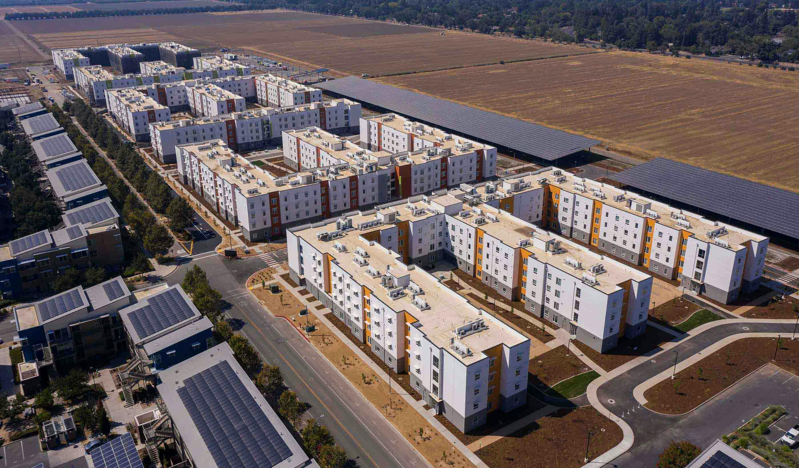 The Green at West Village, a student housing project at the University of California, Davis, includes a net zero energy district. It has a 5.5-megawatt solar array on parking structures. Photo courtesy Stantec