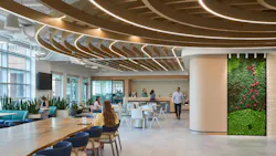 At Boston Consulting Group, dynamic ceiling forms create a sense of movement and direction that supports intuitive wayfinding while subtly expanding the perceived volume of space. Photo courtesy Little