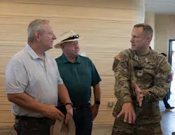 U.S. Army Col. Michael Soyka, Fort Bliss garrison commander, talks amongst members of the El Paso community about the infrastructure of the newly 3-D barracks during a ribbon cutting ceremony on Fort Bliss, Texas, July 28, 2026. This $62.8 million contract consisted of ten open-bay 3D printed transient training barracks, accommodating up to 560 service members and was completed within six months. Photo Credit: U.S. Army photo by Sgt. Brandon Camaquin