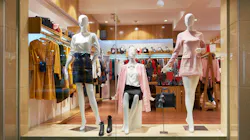 Fashion shop window clothing store front. View of womens fashion clothing store front, Woman mannequin in fashion clothing retail shop window.