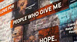 The donor wall mosaic is made of hundreds of local event photos featuring the people who have helped the YWCA of Greater Cincinnati thrive. Photo courtesy GBBN