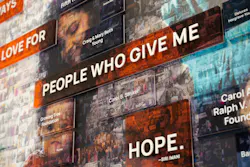 The donor wall mosaic is made of hundreds of local event photos featuring the people who have helped the YWCA of Greater Cincinnati thrive. Photo courtesy GBBN