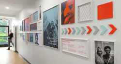 The bespoke designed history wall imparts the legacy and impact of the organization to staff, visitors, and potential donors. Photo courtesy GBBN