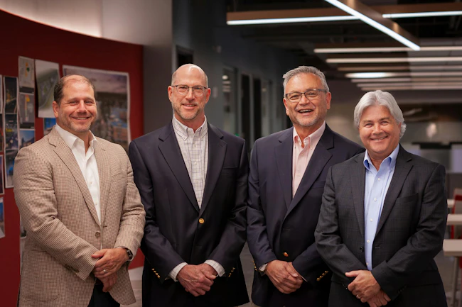 From left to right: Logan Meeks (President, A2H), Scott Rozanski (Principal, SpiritArchitecture Group), Jim Langford (Principal, SpiritArchitecture Group), and Pat Harcourt (CEO, A2H). Photo courtesy A2H