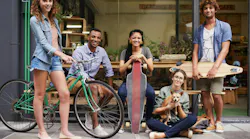 Bike, skateboard and portrait of urban friends on sidewalk together with smile, diversity and bonding. City, gen z style and group of people with street fashion, positive attitude and happy culture