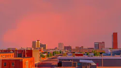 A brilliant sunset colors downtown Lubbock, Texas. Looking down at the downtown district with a brilliant sunset creating color everywhere in Lubbock, Texas